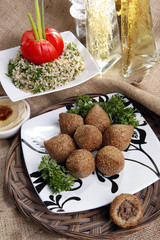 Middle eastern Fried Kibbe with Tabouli and Hummus Tahine