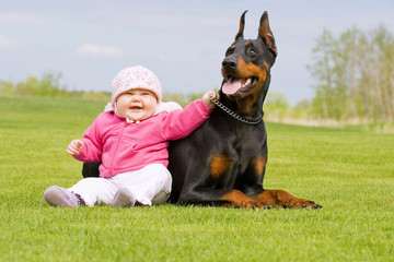 Baby and Big Black Dog