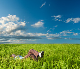 woman laying on the grass