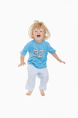 little boy jumping