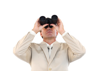 Confident businessman looking through binoculars