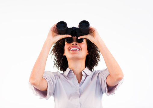 Portrait of ethnic businesswoman holding binoculars upwards - Powered by Adobe