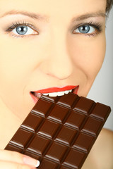 Chocolate girl. Sexy girl with a large block of chocolate