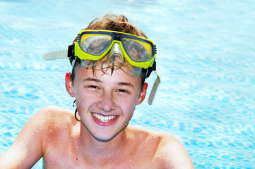 Happy boy in a pool