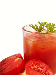 Tomatoes and juice in glass