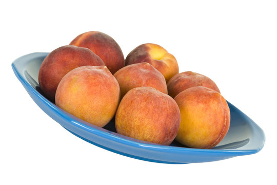 Fresh Peaches On Blue Plate