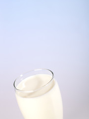 glass of milk with blue backlight