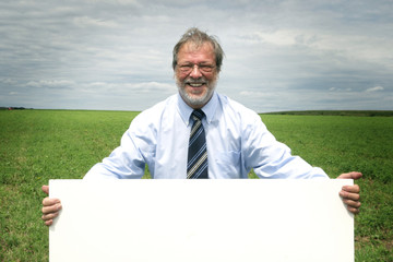 Senior man with blankboard