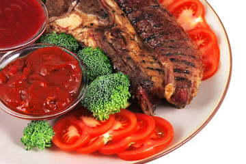 served beef steak and chili sauces