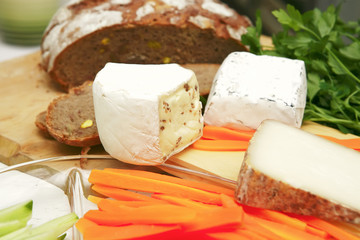 delicatessen cheese on cut board