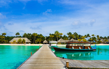 Boat moored at tropical island