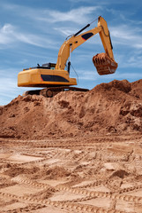 Excavator bulldozer in sandpit