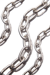 Obraz premium Three steel chains over white background