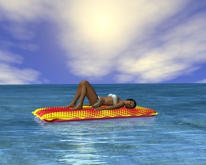 Woman sunbathing in an infinity pool