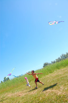 Kids Flying Kites High Up