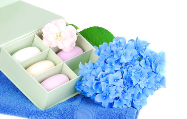 Bar of soap, towel and flowers.