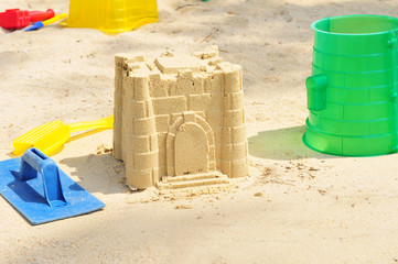 Building Sandcastle By The Beach