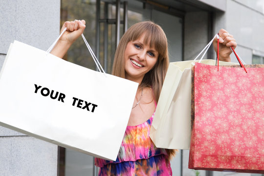 shopping pretty girl with blank bag for your text