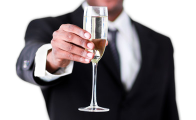 Close-up of an handsome businessman holdng a glass of champagne