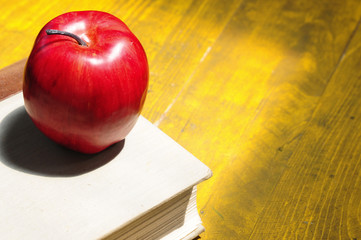 Abstract apple on book.