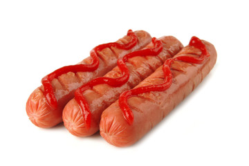 row of sausages with ketchup