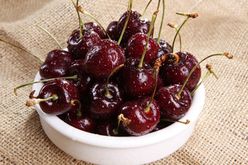 Sweet ripe cherries on sisal