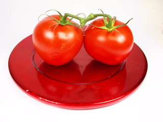 tomatoes served on red plate