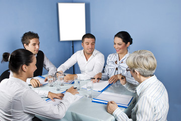 Fototapeta premium Business people around a table at meeting