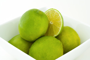 Green limes in a bowl