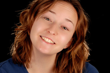 happy smiling young woman on black background