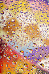 Coloured water drops background.