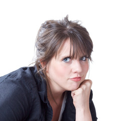 Young woman with head on her fist; head and shoulders