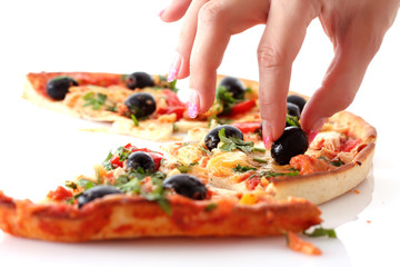 fingers takes olive from tasty pizza