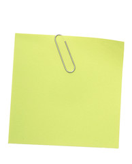 green reminder note with paper clip