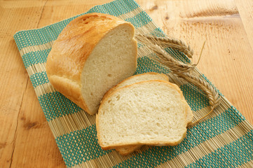 Cottage loaf and cereal on a timber background