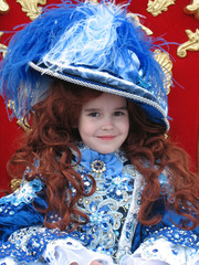 Smiling little girl wearing an antique princess dress