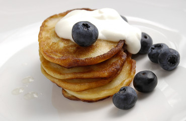 Pancakes with blueberries and cream