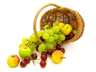 scattered grape cherry and apples in basket