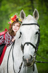 Beautiful little girl in floral wreath
