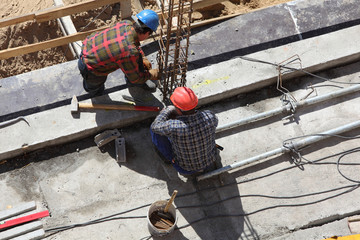 two construction workers on a building project