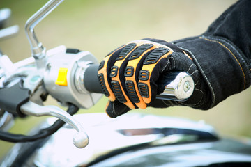 Fototapeta premium Biker hand rests on the steering wheel motorcycle