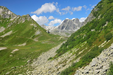 Fototapeta na wymiar Mountain landscape with rock falls in foreground