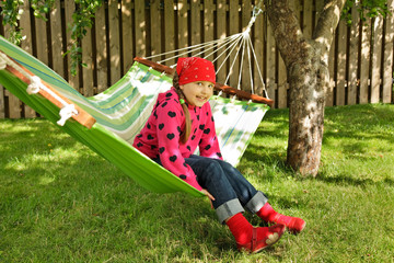 Little girl siting in hammock