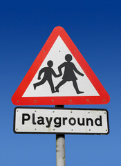 Red playground road sign.