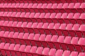 Multiple rows of red seats