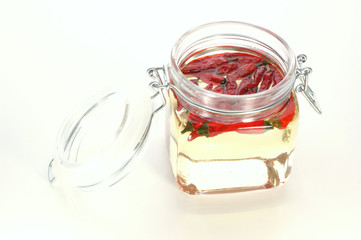 organic red chili in a jar with oil