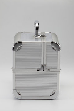 Metal security briefcase in silver on the plain background