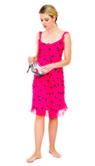 Thoughtful young woman holding high heels