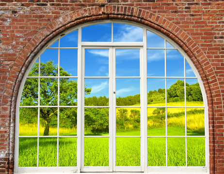 Fototapeta Window frame with view to green field