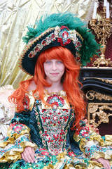 Smiling teenage girl wearing an antique princess dress